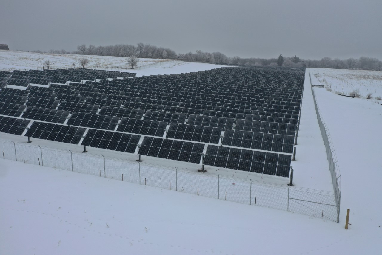 A solar farm in a snowy field